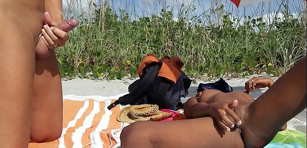  Public beach jerk off. Big cumshot on Aisanippie. Voyeurstyle.